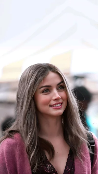 Beautiful Young Woman with Genuine Smile Looking Upwards with Hope and Optimism image