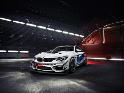 High-Performance White BMW M4 GT4 Race Car in Dark Industrial Garage image