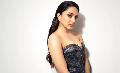 Kiara Advani Striking Glamorous Pose Elegant Cinematic Wallpaper HD Image image