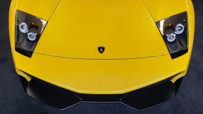 Sleek Yellow Lamborghini Murcielago Supercar Front View with Headlights and Logo image