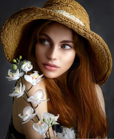 Elegant Young Woman in Straw Hat Adorned with White Orchids image
