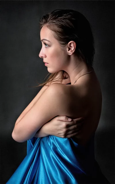Serene Woman Draped in Blue Silk Fabric, Elegance Portrait image