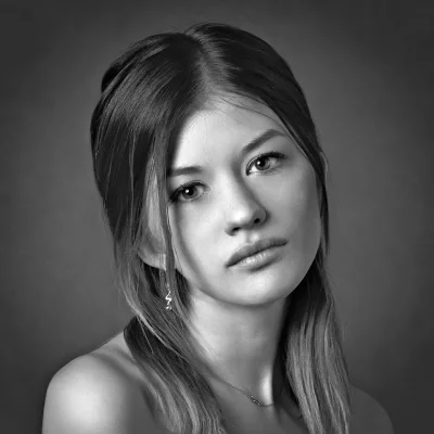 Pensive Young Woman Black and White Studio Portrait with Infinity Necklace image