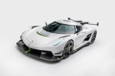 Sleek White Koenigsegg Jesko Absolut Hypercar with Green Accents in Professional Studio Setting image
