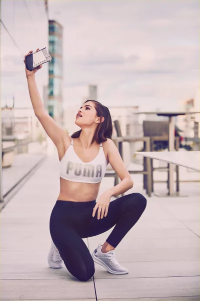Selena Gomez Taking Selfie on Rooftop, Urban Cinematic Wallpaper Background image