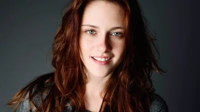 Radiant Portrait of a Young Woman with Red Hair and Captivating Green Eyes image