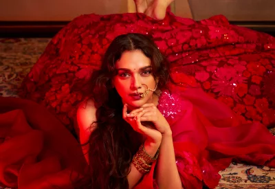 Elegant Indian Woman in Red Traditional Attire and Ornate Jewelry Posing image