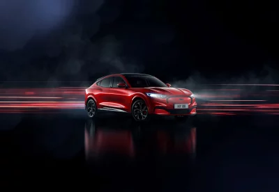 Dynamic Red Ford Mustang Mach-E Electric SUV with Blurred Speed Trails image