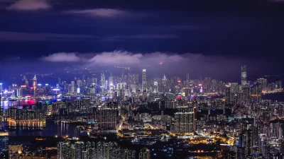 Vibrant Metropolitan Skyline at Night with Dramatic Fog and City Lights image