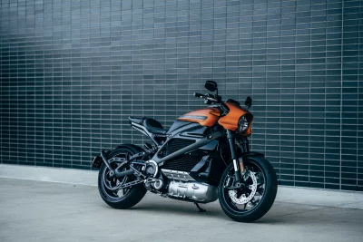 Sleek Orange Electric Motorcycle HD Wallpaper Modern Urban Style Cinematic Photography image