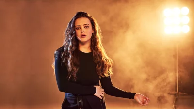 Katherine Langford Posing Confidently in Studio with Warm Lights and Smoke image