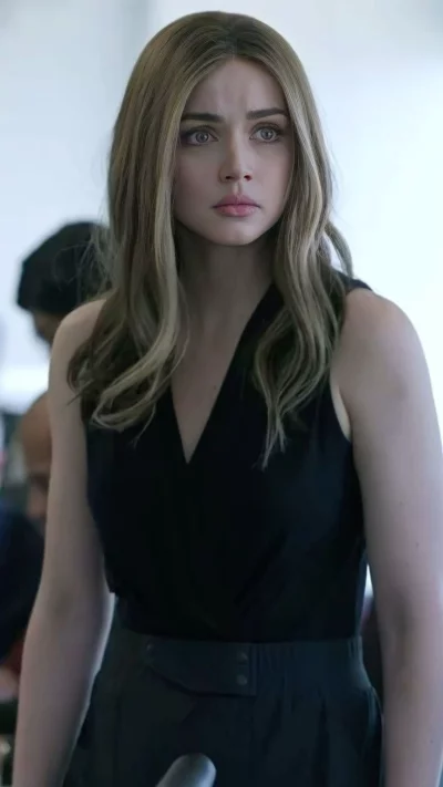 Portrait of a confident young woman with a thoughtful expression in a contemporary setting image