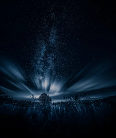 Breathtaking Ethereal Night Landscape with Radiant Milky Way and Streaky Clouds Wallpaper image