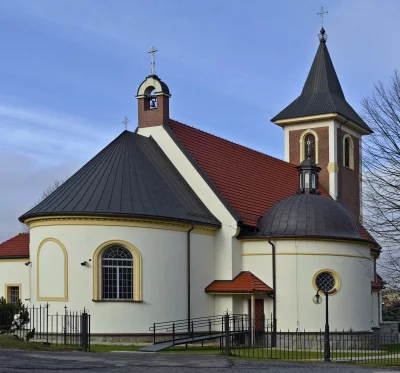 Classic European Church with Bell Tower, Dome, and Ornate Fence image