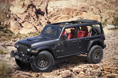 Rugged Grey Jeep Wrangler Navigating Rocky Desert Terrain Adventure Vehicle image