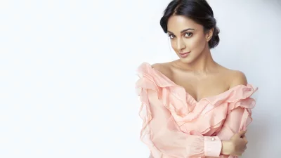 Elegant Kiara Advani Posing in Pink Off-Shoulder Top Studio Portrait Wallpaper image