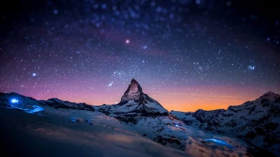 Majestic Matterhorn Peak Under a Dazzling Starry Night Sky at Twilight image