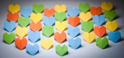 Vibrant Origami Hearts Pattern Displaying Love and Diversity image