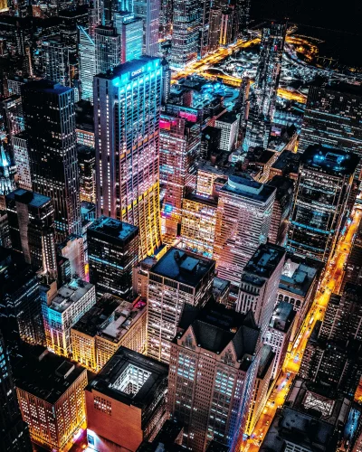 Aerial View of a Vibrant Metropolis at Night with Glowing Neon Lights image