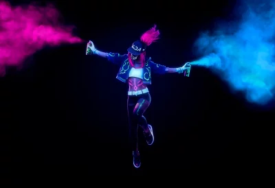 Vibrant Woman with Glowing Neon Spray Cans in Dynamic Urban Pose image