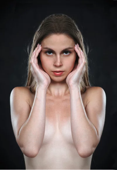 Captivating Portrait of Young Woman with Intense Gaze and Hands Framing Face image