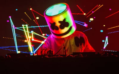 Energetic DJ Marshmello performs captivating electronic dance music at a vibrant live concert image