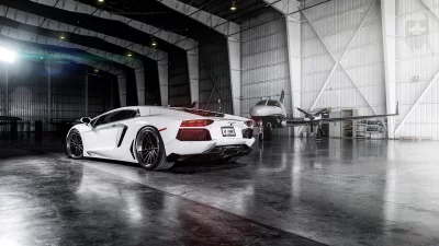 White Lamborghini Aventador Supercar and Private Jet in Luxury Hangar image