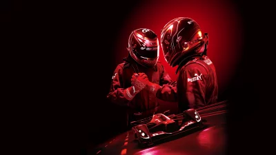 Professional Race Drivers in Red Suits Huddle, Futuristic Racing Car on Track image
