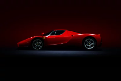 Sleek Red Ferrari Enzo Supercar Luxury Vehicle in Dynamic Studio Shot image