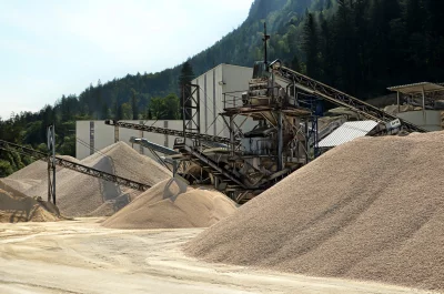 Industrial Gravel Quarry with Conveyor Belts and Massive Stone Piles image
