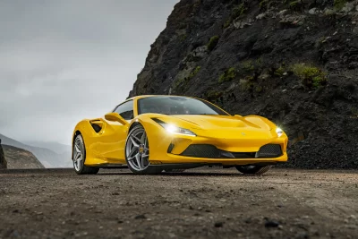 Dynamic Yellow Ferrari F8 Tributo Performance Car on Outdoor Road image