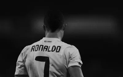 Legendary Footballer Ronaldo's Back in Iconic Real Madrid Jersey Black and White image