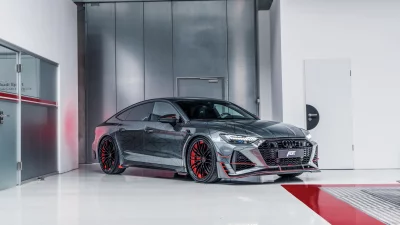 Customized ABT Sportsline Audi RS7 Sportback with Distinctive Geometric Livery and Red Accents image