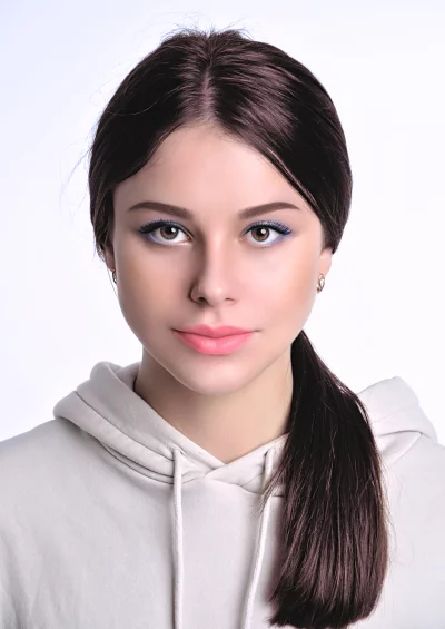 Beautiful Young Woman Gazing at Camera in Hoodie Natural Beauty Studio Shot image