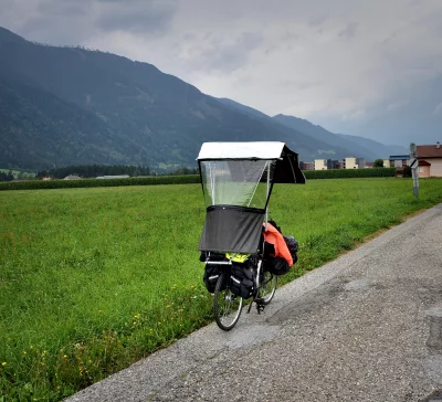 Touring Bicycle with Rain Canopy in Mountainous Green Landscape image