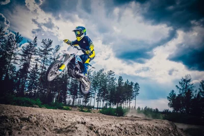 Dynamic Motocross Rider Mid-Air Jump on Dirt Track, Adrenaline Extreme Sports Action image