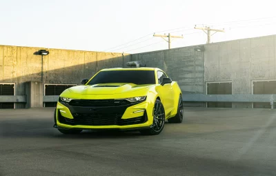 Vibrant Yellow Chevrolet Camaro Modern Sports Car Dynamic Design Cinematic Wallpaper Image image