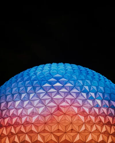 Vibrant Geodesic Dome with Geometric Gradient Lighting on Dark Background image
