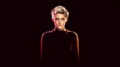 Striking studio portrait of a fashionable woman with short blonde hair under vibrant split lighting image