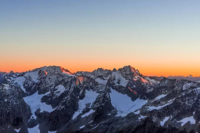 Panoramic Mountain Range Sunrise with Snow-Capped Peaks and Vibrant Sky image