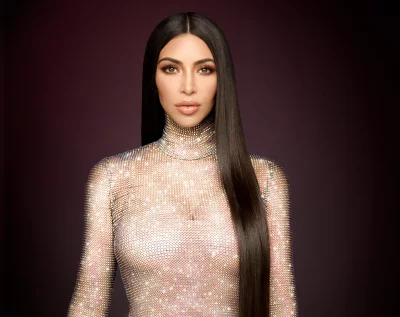 Confident Woman in Shimmering Crystal Turtleneck Top with Long Dark Hair image