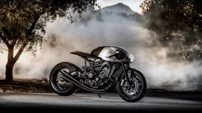 Dynamic Custom Cafe Racer Motorcycle in Silver and Black on Misty Road at Twilight image