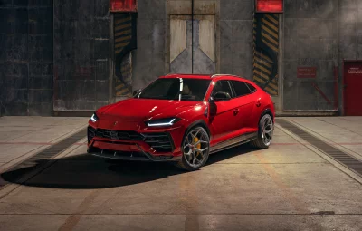 Sleek Red Lamborghini Urus Luxury SUV in Industrial Garage Setting image