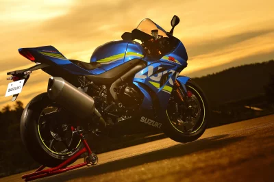 Sleek Blue Suzuki GSX-R Superbike Parked on Track at Golden Sunset image