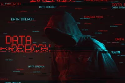 Hooded Hacker Silhouette Amidst Glitching Data Breach Alert on Dark Screen Background image