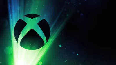 Dynamic Xbox Logo with Radiant Green and Blue Abstract Light Rays image