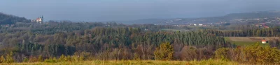 Panoramic View of European Countryside with Monastery and Rustic Chapel image