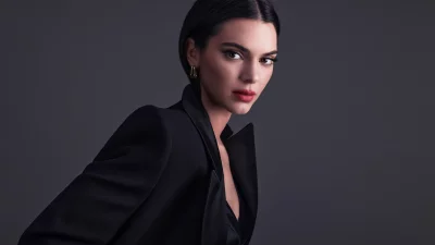 Elegant Woman in Black Blazer with Red Lipstick and Gold Earrings image