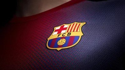 Close-up of FC Barcelona's Iconic Crest on Textured Soccer Jersey Fabric image
