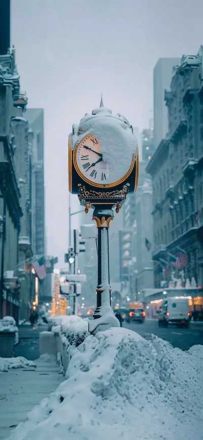 Snowy City Street with Lamp Post Clock and Christmas Tree